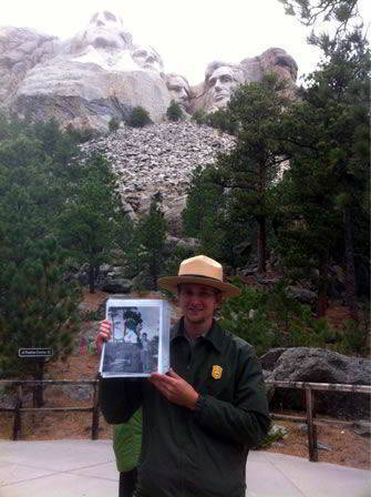 Ranger Andy Frieder holding a picture of his grandfather with Gutzon Borglum Ranger Andy Frieder holding a picture of his grandfather with Gutzon Borglum
